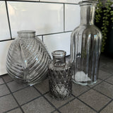 Smokey Grey Small&nbsp;Glass Bottle Vases
Various styles
Leaf pattern H13 x Dia 11cm

Tall Slim Ribbed H22.5 x Dia 10cm

Tall Ribbed H19 x Dia 7.5cm
Mini Geometric Bottle H9cm x Dia 5cm