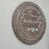 Round 42cm distressed wooden solid sign with a ridge and family quote;
Round the edge at the top - "A little bit of crazy"
In the middle - "Our Family" with 3 hearts.
Round the edge at the bottom - A little of loud &amp; a whole love of love"&nbsp;