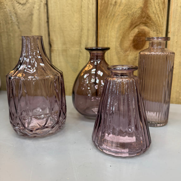 New to the collection - Amethyst Small Glass Bottle Vases
Various styles
Wide ribbed/diamond shape & narrow top H13.8cm 
Ribbed wide base & narrow top W7.4 x H9.9cm
Bud Vase H12cm
Tall Slim Ribbed  H13.2cm 