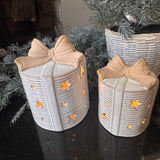 Neutral glazed Ceramic LED detailed Present with a ribbed design &amp; rough textured bow topper and lots of open stars &amp; dots to let the light through when switched on..
Available in 2 sizes - Small H11cm &amp; Large H13cm