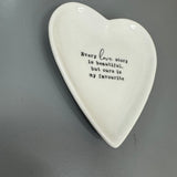 White Ceramic Small 10cm Heart Dish with a quote in black text;
'Every love story is beautiful, but ours is my favourite;