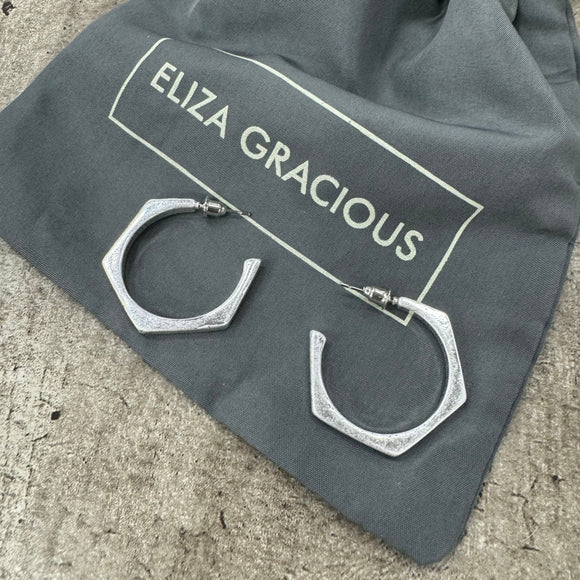 <h3><em>Eliza Gracious - quality, affordable design led branded costume jewellery.</em></h3> <h3>Burnished Silver Angular Hoop Earrings EE0200