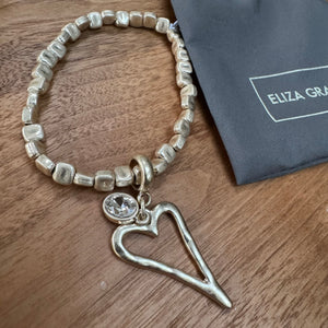 Eliza Gracious - Stretch square bead bracelet with heart charm