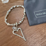 Eliza Gracious - Stretch square bead bracelet with heart charm