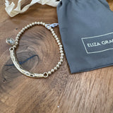 Eliza Gracious - Stretch Ball Bead Bracelet with Bar & Jewel Charm