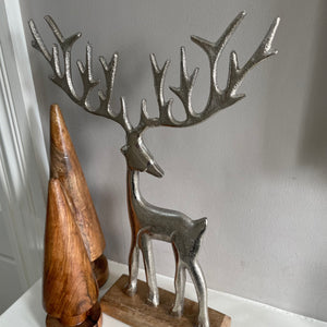 Brushed Silver Reindeers with large antlers on Wooden Base Available in 2 sizes; 23cm & 30cm