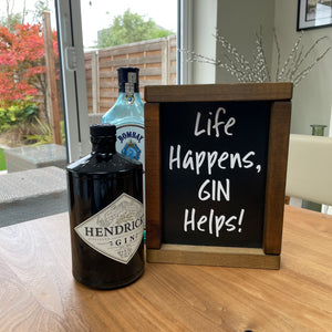 Made in the UK by Giggle Gift co. Small Rectangular H24cm Framed Plaque with Black vinyl & white text "Life Happens, Gin Helps!"