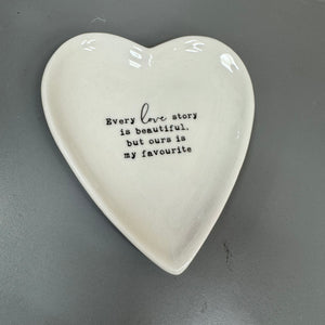 White Ceramic Small 10cm Heart Dish with a quote in black text;
'Every love story is beautiful, but ours is my favourite;