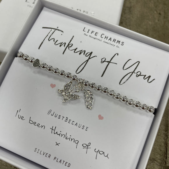 Life Charms the Thoughtful Jewellery Co. Just Because Bracelet Collection; Thinking Of You I've been thinking of you x Pure silver plated dangling butterfly and leaf charms presented on a 5mm beaded stretch bracelet and a branded Life Charm small charm