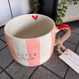 Belly Button Designs - Mabel Range
Stoneware Mug 340ml hand-painted wide, pastel pink &amp; white vertical stripes
Text stamped on the front - Super Mum