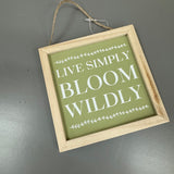 Hanging Wooden 12cm square Sign with a sage green background and white text;
'Live simply bloom wildly'&nbsp;