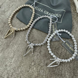Eliza Gracious - Stretch bracelet with twin heart charms | 3 Colours