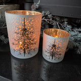 Frosted Glass Candle Holders featuring tree with a wintry background &amp; gold interior&nbsp;
Available in 2 sizes - Small 8cm &amp; Large 12.5cm