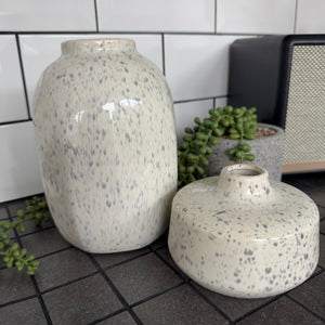 Off white/cream Glazed ceramic Round Vases with a grey speckled/fleck pattern all the way round
Available in 2 sizes; Tall H19.5cm &amp; Short Squat H8.5cm