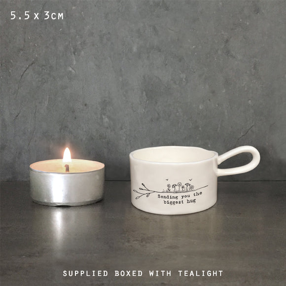 East of India Perfect Gifts with a meaningful quotes;
Small round T-LIght holder with handle 5.5x3cm gift boxed & t-light included
Quote 'Sending you the biggest hug'  5711