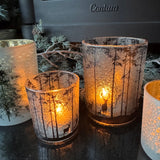 Frosted Glass Candle Holders featuring trees &amp; deer detail around the exterior
Available in 2 sizes - Small 8cm &amp; Large 12.5cm