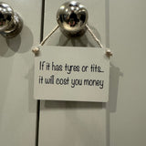 Mini Metal Hanging Sign 9x6.5cm with fun quote: "If it has tyres or tits it will cost you money”