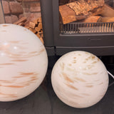 Hand crafted unique high quality glass lamps



Glass Pebble Hand-Blown Lamp - Small H18cm
Design - White &amp; Gold glitter shimmer Planet Lamp