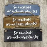 Made in the UK by Giggle Gift Co. Wooden L29.5cm Hanging Sign "So excited we wet our plants!"