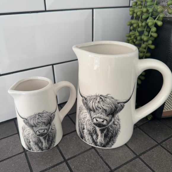 White glazed Ceramic Jugs with a black classy pencil illustration of Highland Cows

Small 11cm & Large 16cm