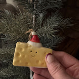 Fun Christmas ceramic Hanging Decoration
Block of Cheddar Cheese wearing a Santa's hat 6.4cm