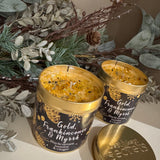 Best kept Secrets Christmas - Elegance Gold Tin Candle Collection&nbsp;
Presented in a festive gold tin with images of gold pine cones, snowflake, stars on a black background
Fragrance with sparkling golden glitter for that elegant finishing touch;&nbsp;
Gold, Frankincense &amp; Myrrh - Blackcurrant, Jasmine &amp; Ginger