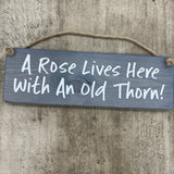 Wooden Hanging Sign - "A rose lives here with an old thorn!"