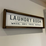 Made in the UK by Giggle Gift co.
Rectangular L64cm Framed Plaque with Old White vinyl;
"Laundry Room Wash, Dry, Fold, Repeat"