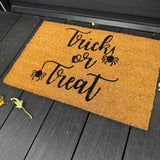 Natural Coir Doormat 40x60cm with the following quote;
'Trick or Treat' with spiders hanging from the letter T's