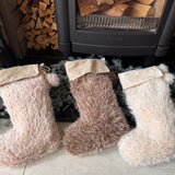 Shaggy faux fur textured Stocking with a linen style fabric cuff and hanging pom poms 37cm
Available in 3 neutral colours - Ivory, Brown &amp; Linen&nbsp;