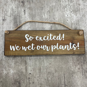 Made in the UK by Giggle Gift Co. Wooden L29.5cm Hanging Sign "So excited we wet our plants!"