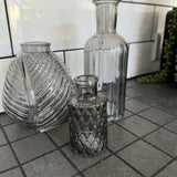 Smokey Grey Small&nbsp;Glass Bottle Vases
Various styles
Leaf pattern H13 x Dia 11cm

Tall Slim Ribbed H22.5 x Dia 10cm

Tall Ribbed H19 x Dia 7.5cm
Mini Geometric Bottle H9cm x Dia 5cm