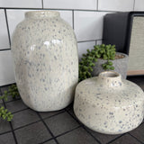 Off white/cream Glazed ceramic Round Vases with a grey speckled/fleck pattern all the way round
Available in 2 sizes; Tall H19.5cm &amp; Short Squat H8.5cm