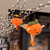 Fabric pumpkin decoration with dangling legs