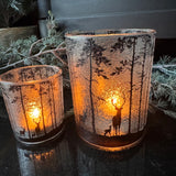 Frosted Glass Candle Holders featuring trees &amp; deer detail around the exterior
Available in 2 sizes - Small 8cm &amp; Large 12.5cm