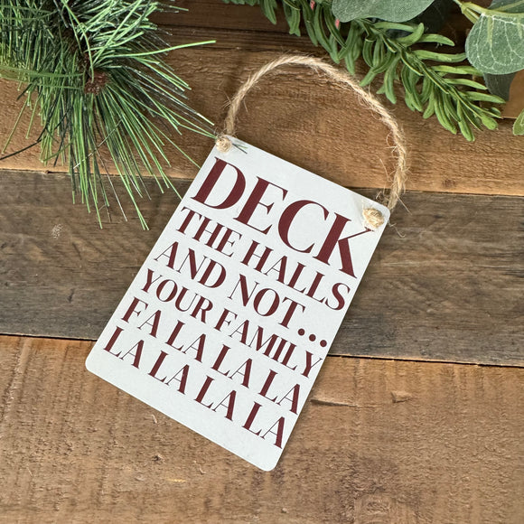 Christmas Mini Metal Hanging Sign 9cm - Off white sign with deep red writing;
Quote - Deck the Halls and not...Your family Fa La La La La La La La