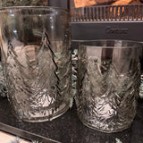 Smokey Grey Glass Candle Holders featuring embossed Christmas tree around the exterior
Available in 3 sizes - Small 13.5cm, Medium 16.5cm &amp; Large 22cm