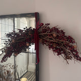 Festive hanging decoration with deep red &amp; burgundy berries with natural twigs &amp; pinecones and matching velvet ribbon bows 60cm