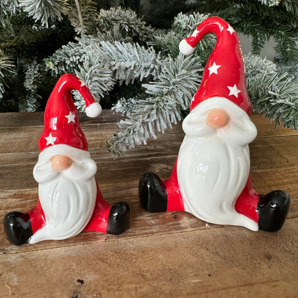 Christmas Ceramic Sitting Gonk with a Red body, red hat with white stars and a long white beard and button nose 
Available in 2 sizes; Small 9cm & Large 12cm