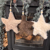 Shaggy faux fur textured plush Stars with beaded detail on hanging string 17cm
Available in 3 neutral colours - Ivory, Brown &amp; Beige