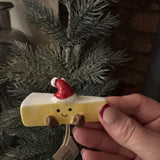 Fun Christmas ceramic Hanging Decoration
Block of Brie Cheese wearing a Santa's hat and smiling face