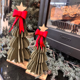 Layered Green felt Tree finished off with a red bow at the top and a wooden star stood on a wooden base&nbsp;
Available in 2 sizes: Small 24.5cm &amp; Large 31.5cm

