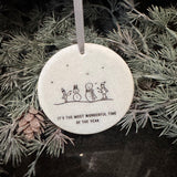 Small gifts with a meaningful quote at Christmas&nbsp;
Small white Marble round hanging flat disc 7cm
Black Text Quote - 'It's the most wonderful time of the year'&nbsp;
Image - Two snowmen being made by two people whilst its snowing..&nbsp;