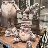 Sitting Gonk with a tall ribbed faux fur grey hat, button nose and a fluffy white beard with gold threads giving it a little sparkle H45cm&nbsp;