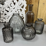 Smokey Grey Small&nbsp;Glass Bottle Vases
Various styles
Leaf pattern H13 x Dia 11cm

Tall Ribbed H19 x Dia 7.5cm
Mini Geometric Bottle H9cm x Dia 5cm
Round Ribbed H8.4 x Dia8.3cm
Small Ribbed H10 x 5cm