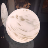 Hand crafted unique high quality glass lamps



Glass Pebble Hand-Blown Large Lamp - Large H28cm
Design - White &amp; Gold glitter shimmer Planet Lamp
