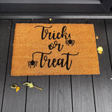 Natural Coir Doormat 40x60cm with the following quote;
'Trick or Treat' with spiders hanging from the letter T's