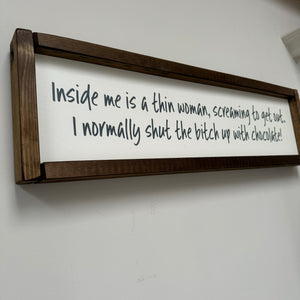 Made in the UK by Giggle Gift co. Rectangular L64cm Framed Plaque with Old White vinyl' "Inside me is a thin woman, screaming to get out.&nbsp; I normally shut the bitch up with chocolate!"