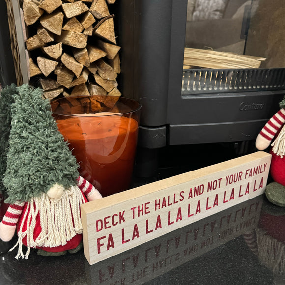 Wooden hanging / standing long Christmas Sign L40cm fun sign decorated in red glitter text; 

'Deck the Halls and not your Family Fa La La La La La La La La' 