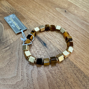 Eliza Gracious - quality affordable design led branded costume jewellery.

Stretch square resin &amp; metal beaded Bracelet with pale gold detail

Available in 2 colours - Brown beads &amp; Grey EB0555